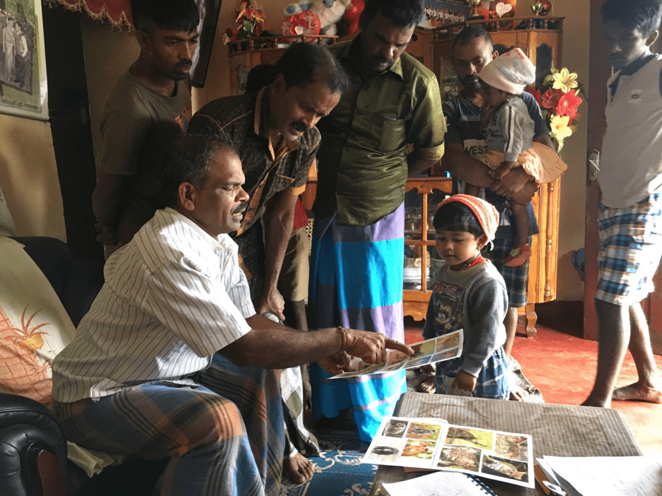 Interviews being conducted in the Central Hills, where cattle owners often work on tea estates as well to earn extra income. In this photo they are identifying wildlife in the area. Image