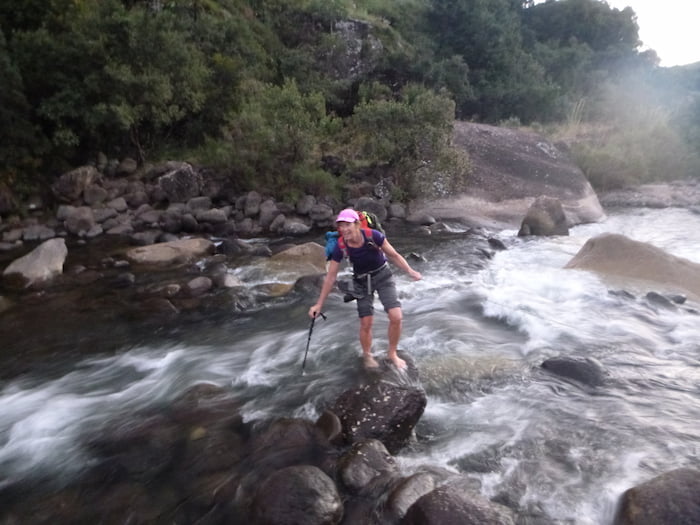 Fiona crosses a river on the hike in to Mafadi Image