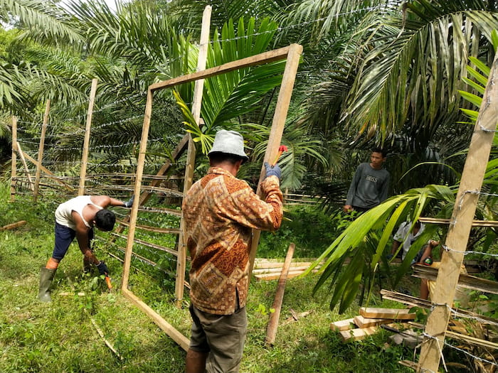 ITP Tiger Team work with local community to build tiger proof cattle corrals to protect livelihoods Image