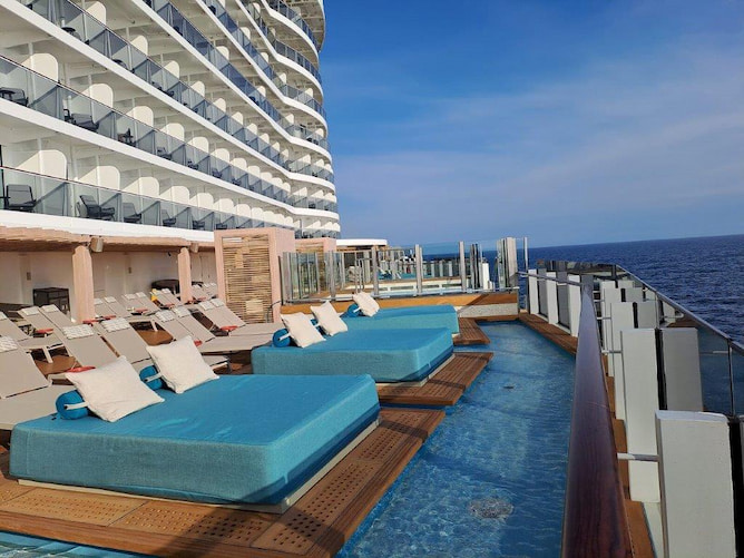Cool by the pool: lounging is one of NCL Prima’s big selling points. Cruise ship pool and lounge