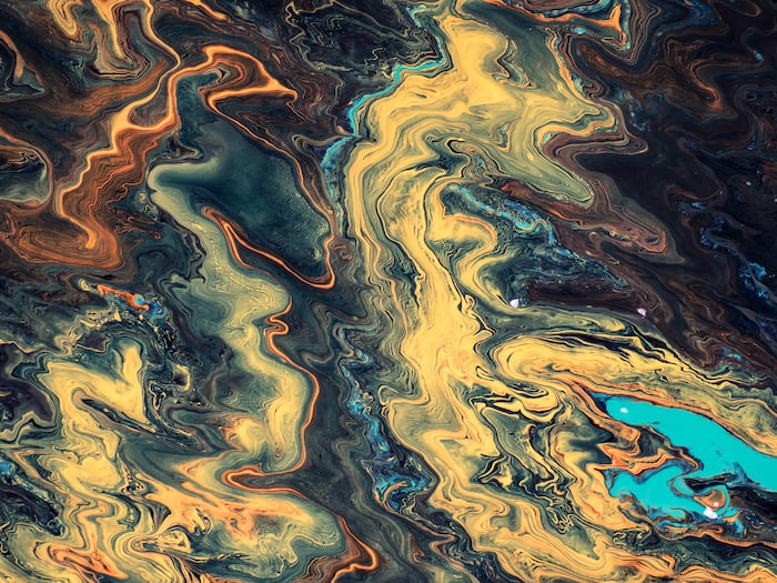 Oil rigs present many environmental hazards, even after decommissioning, such as oil spills and releasing toxic compounds into the marine environment. Dan Cristian Pădureț, Unsplash. oil-ocean-abstract-painting