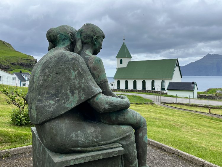 bronze mother and two children looked forlornly out to sea, while plaques commemorated the many drowned husbands and sons.